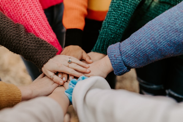hands coming together in a circle
