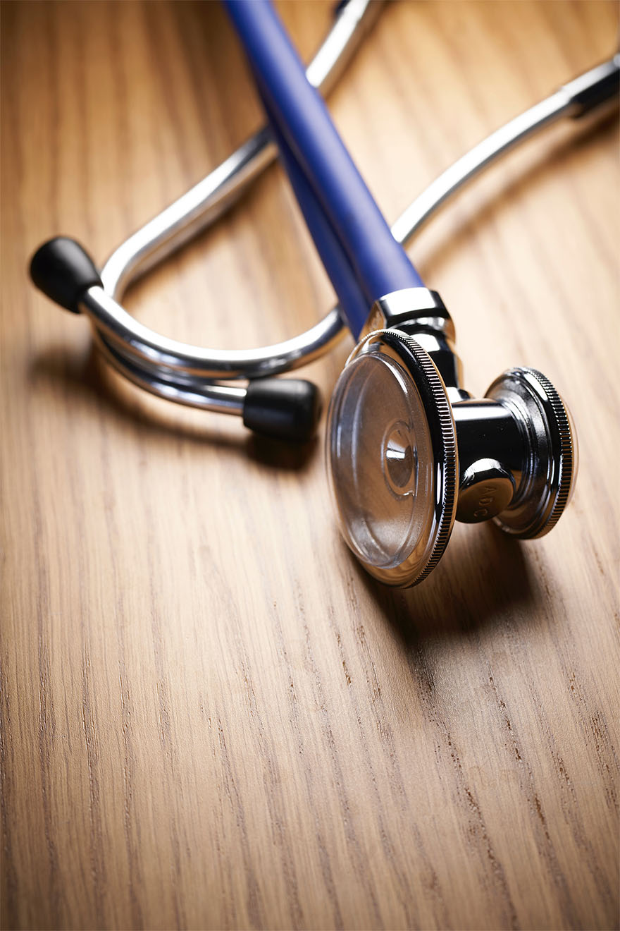 stethoscope on a wooden table
