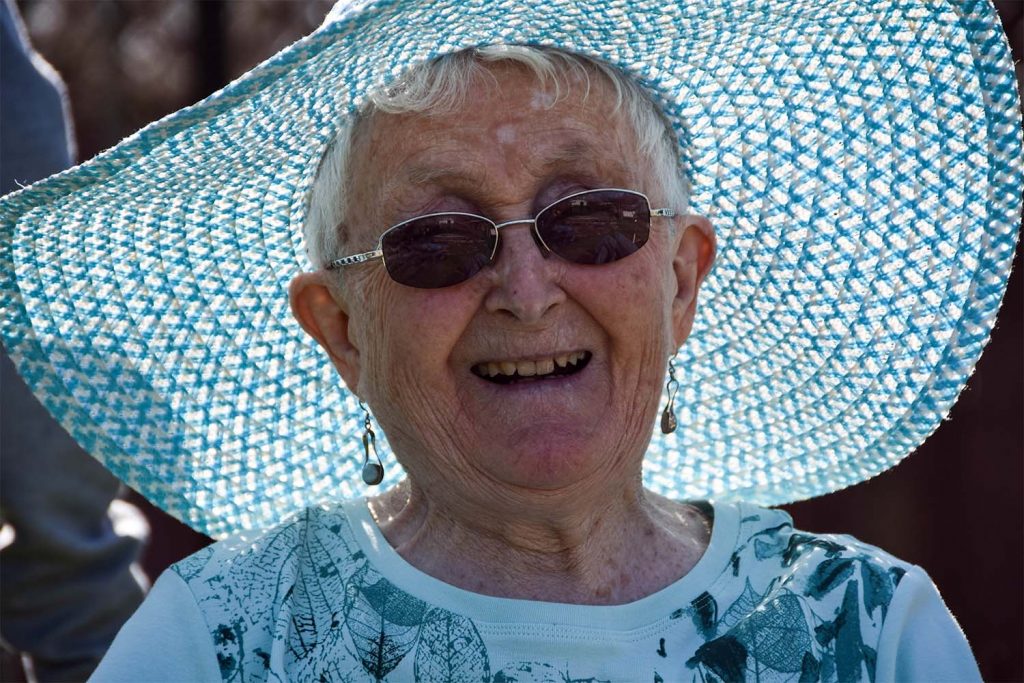 old lady with blue jumper smiling